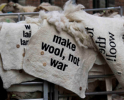 Embroidered felted wool blankets with statements for the wool march brussels